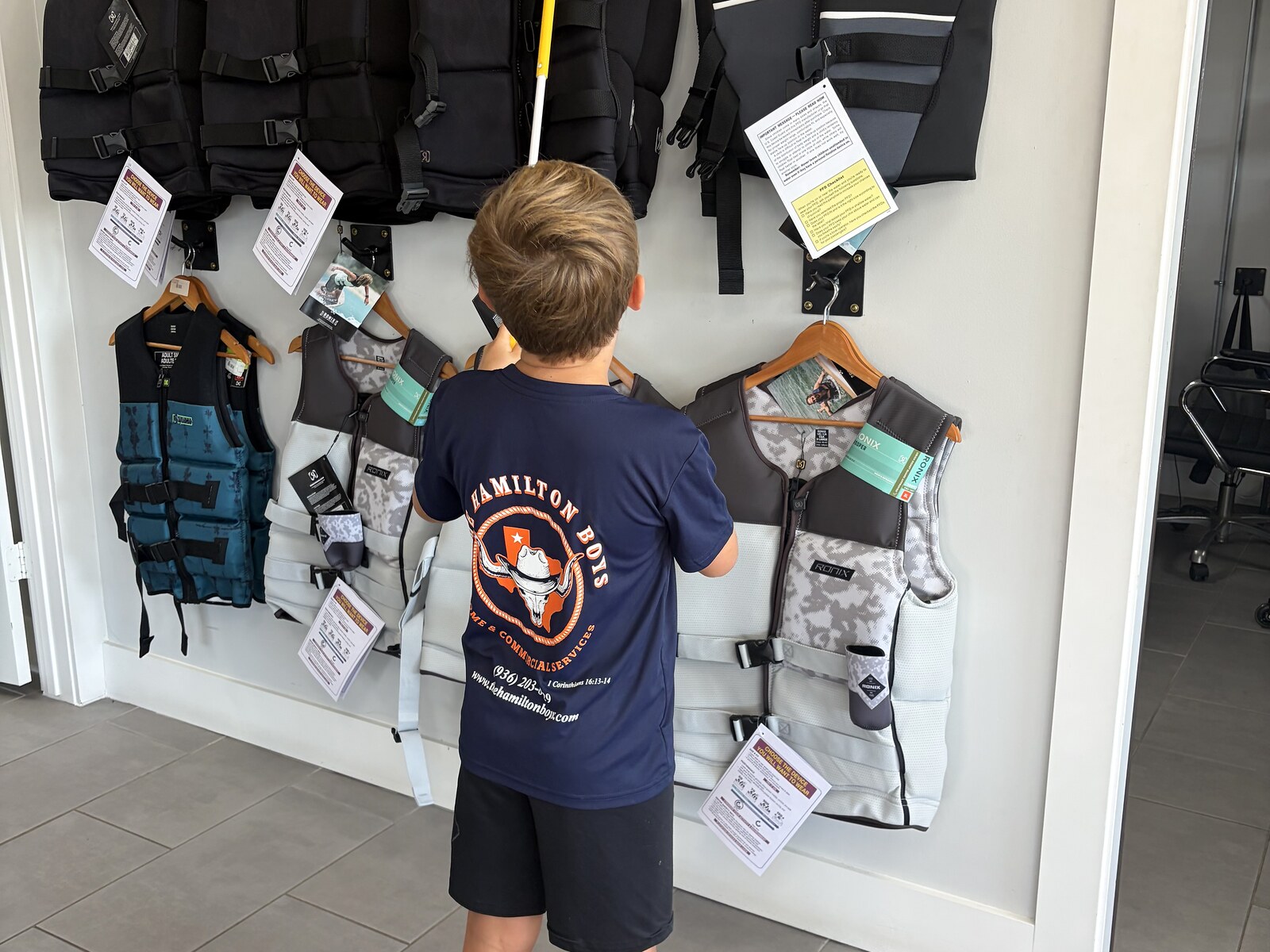 Hamilton Boys crew cleaning retail display area