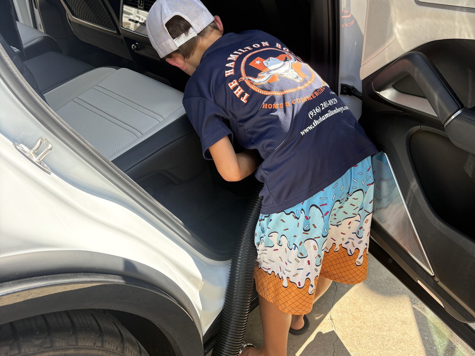 Hamilton Boys crew cleaning truck interior