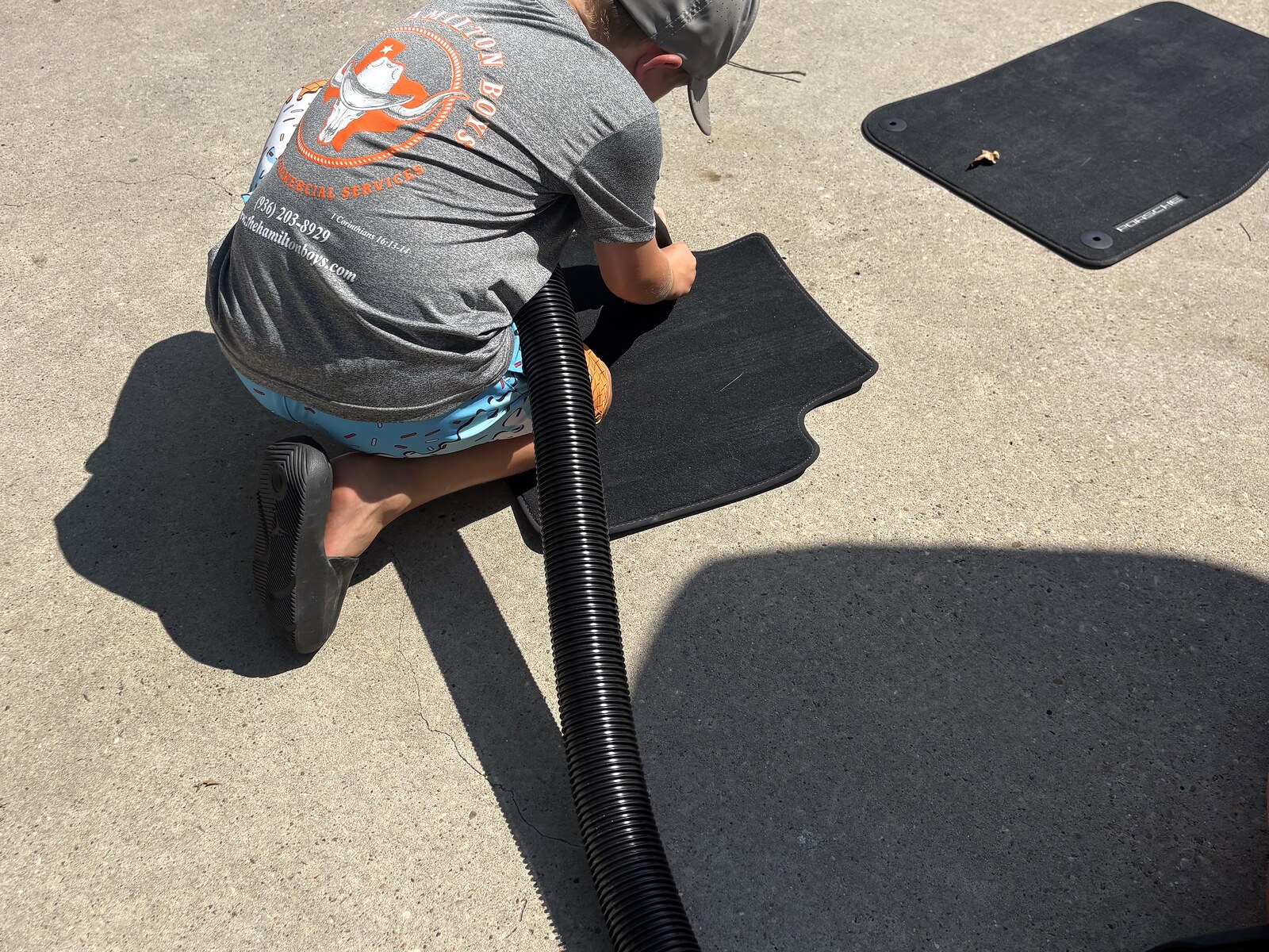 Hamilton Boys crew cleaning floor mat