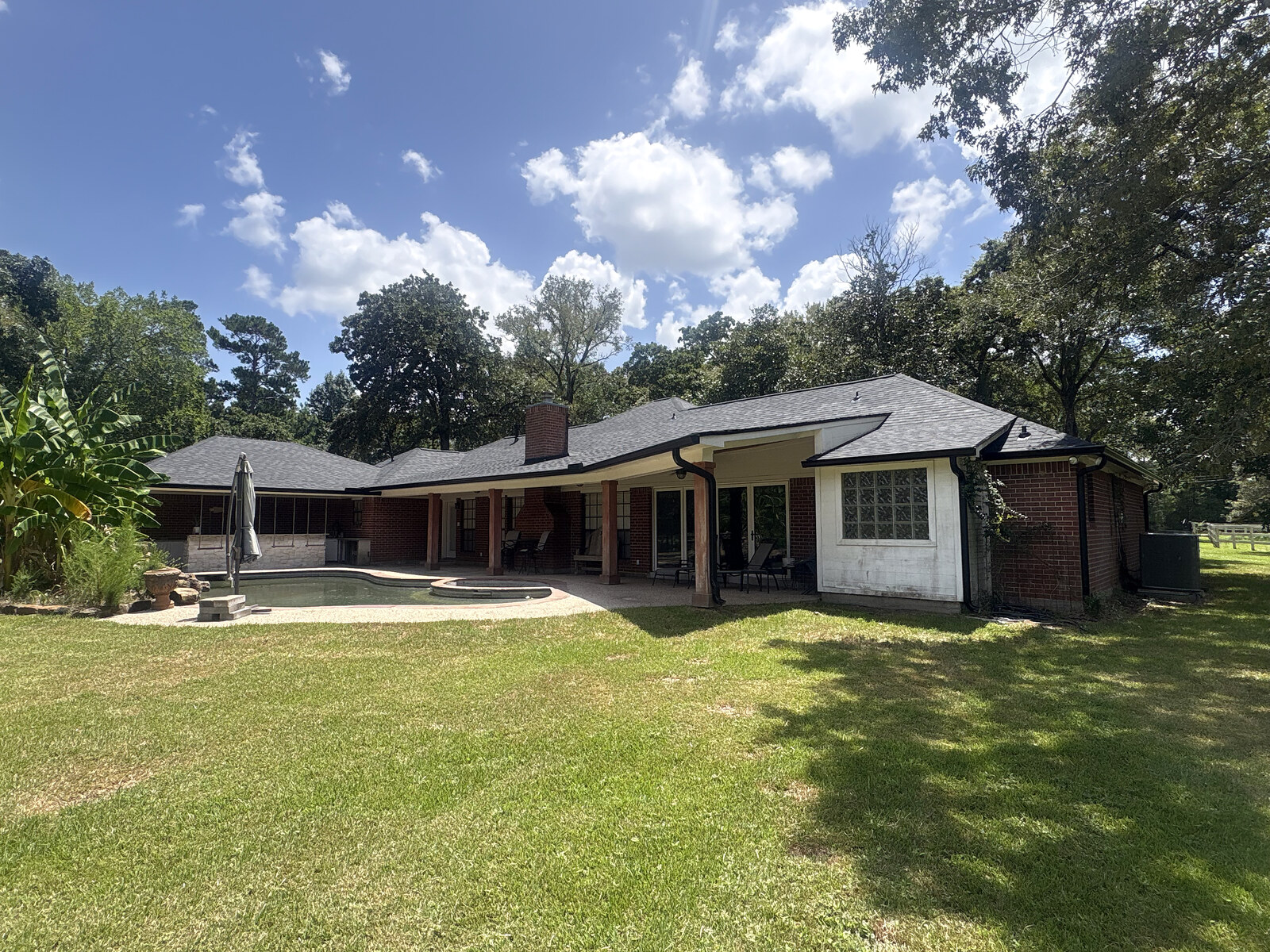 Home serviced for gutter cleaning - backyard exterior