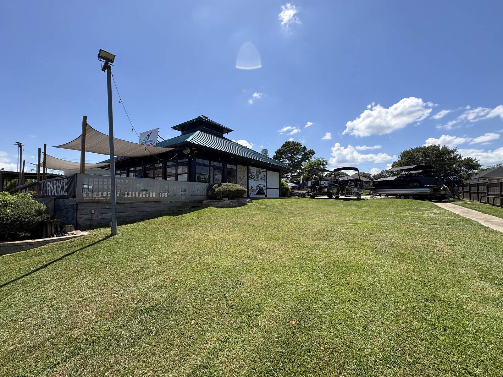 HTX Sales Office after landscaping - full lot freshly mowed lawn