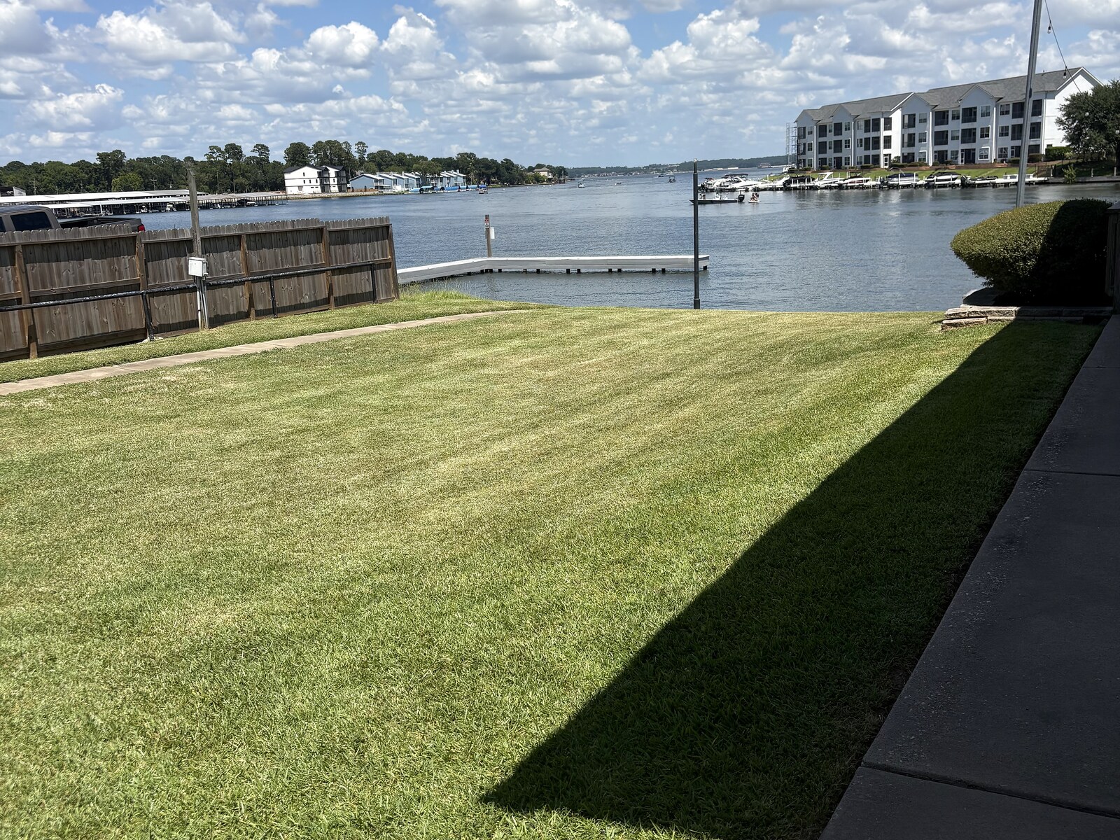 HTX Sales Office after landscaping - striped waterfront lawn