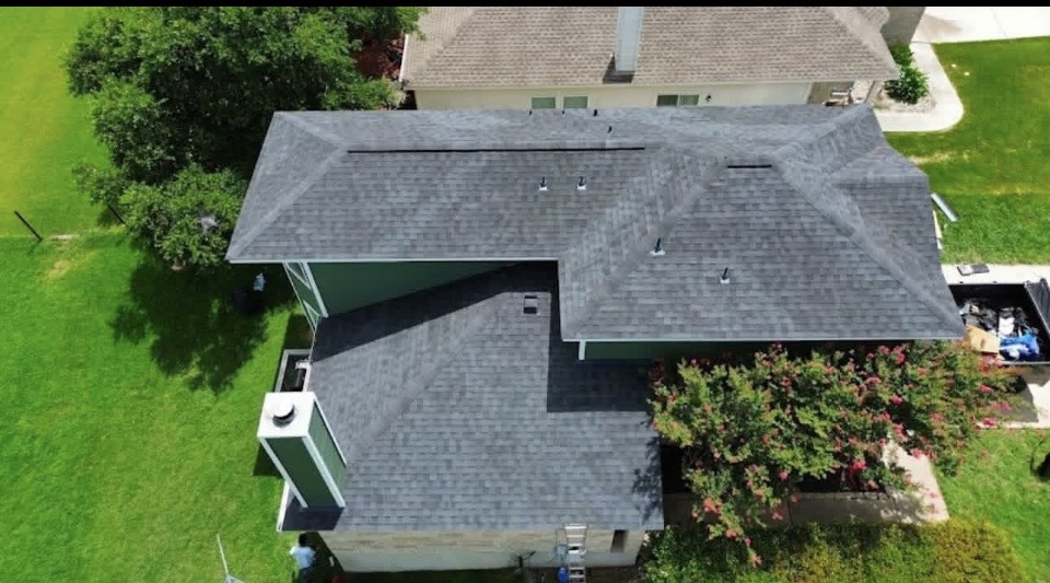 Stages of a roof install from tear-off to finished shingles
